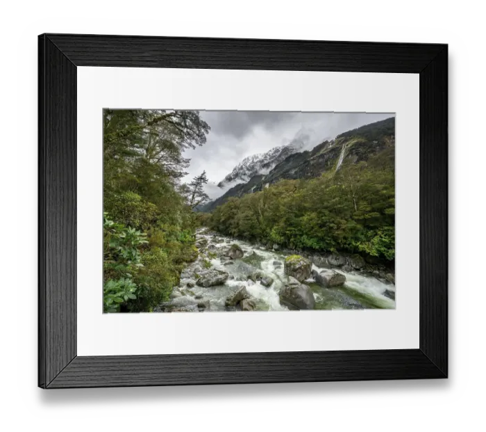 Framed Print : Hollyford river with snowy mountains