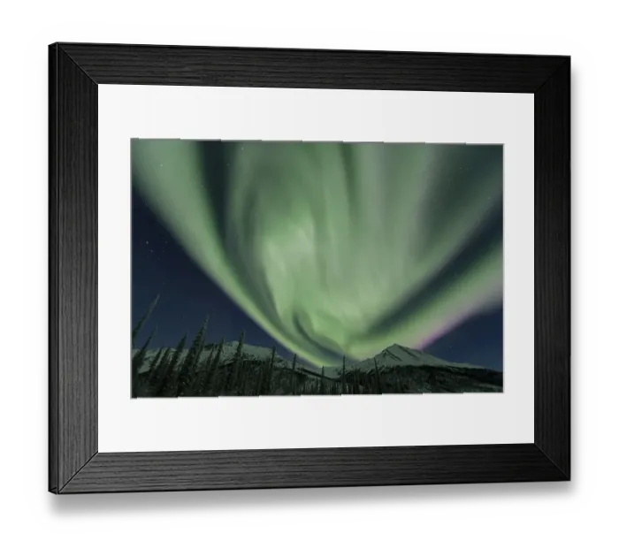 Framed Print : Northern Lights over snowy mountains and trees Framed Print : Northern Lights over snowy mountains and trees