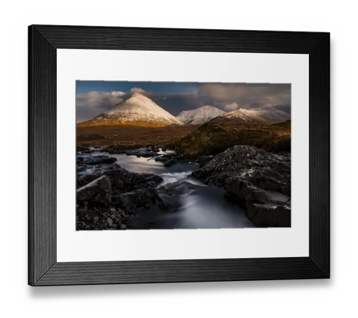 Framed Print : AltDearg Mor with snow-covered peaks of the Cullins Mountains in Highland landscape