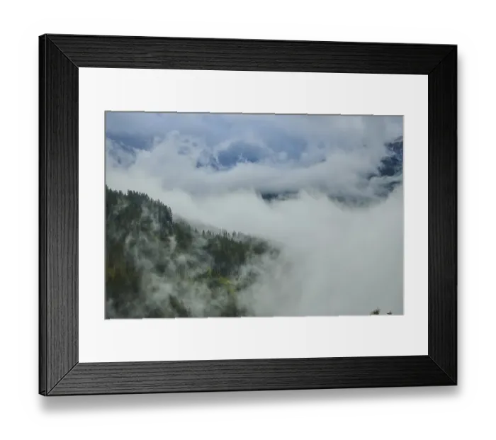 Framed Print : Clouds lying in the valley between Mountains at Hochalpenstrasse