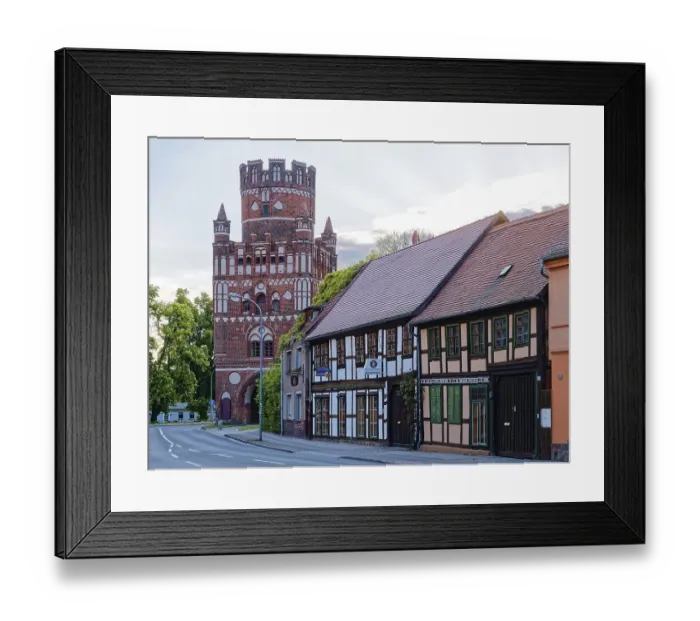 Framed Print : Half-timbered houses in front of the historic Uenglinger Tor tor in the old town centre of Stendal in the Altmark Framed Print : Half-timbered houses in front of the historic Uenglinger Tor tor in the old town centre of Stendal in the Altmark