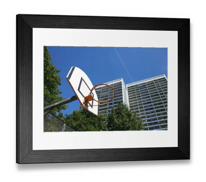 Framed Print : Basketball court at a residential complex in the city
