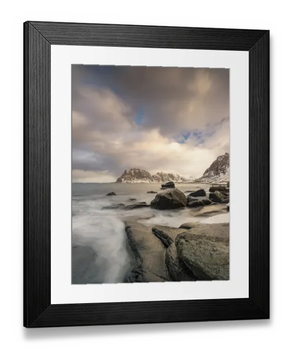 Framed Print : Rounded rocks on Utakleiv beach in a dramatic cloudy atmosphere