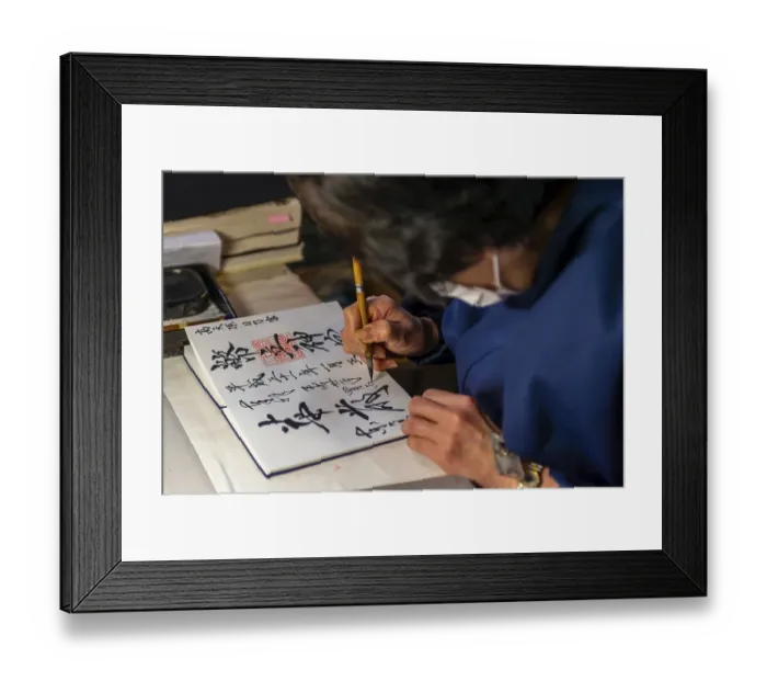 Framed Print : Woman writes Japanese characters