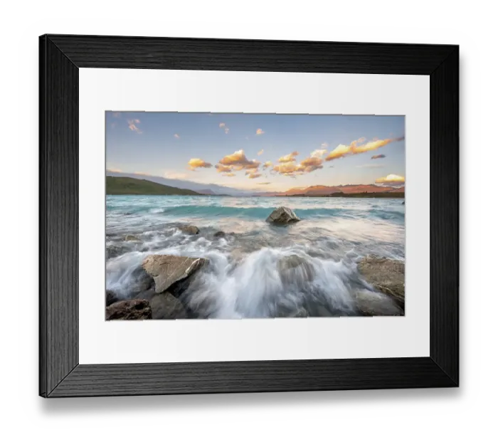 Framed Print : Stones on shore, lake with sunset swell