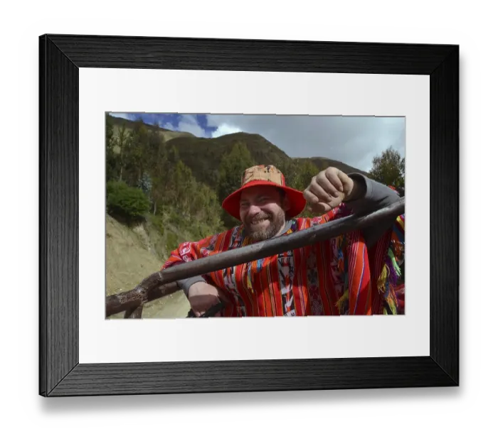 Framed Print : Tourist wearing a traditional poncho of the Quechua Indians riding in a truck Framed Print : Tourist wearing a traditional poncho of the Quechua Indians riding in a truck