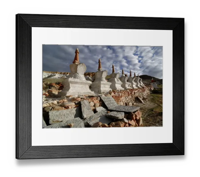 Framed Print : Tibetan Mani Stones in front of Chorten or Stupas at the holy pilgrimage site of Thirtapuri