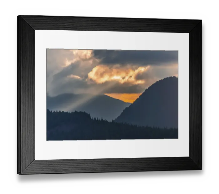 Framed Print : Hilly wooded mountain landscape at sunset with dramatic clouds Framed Print : Hilly wooded mountain landscape at sunset with dramatic clouds