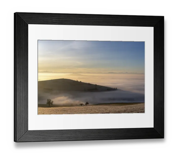 Framed Print : View from the old post road near Leipferdingen into the wintry and fog-covered Hegaulandschaft shortly after sunrise
