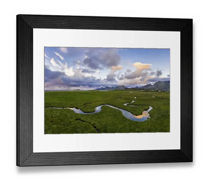 Framed Print : Curving river with mountains near Fredvang