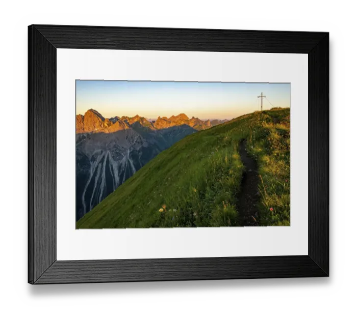 Framed Print : Small mountain trail with flower meadow and summit of the Uentschenspitze at sunrise