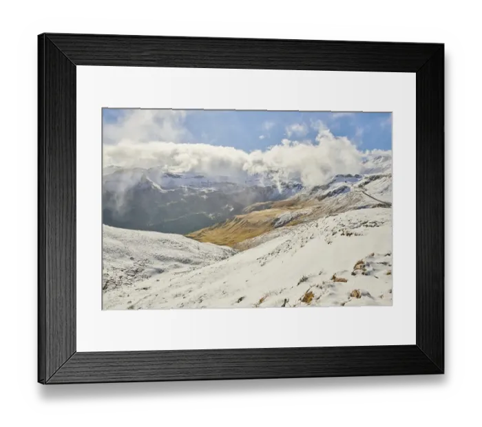 Framed Print : Snowy Mountains with clouds at Hochalpenstrasse