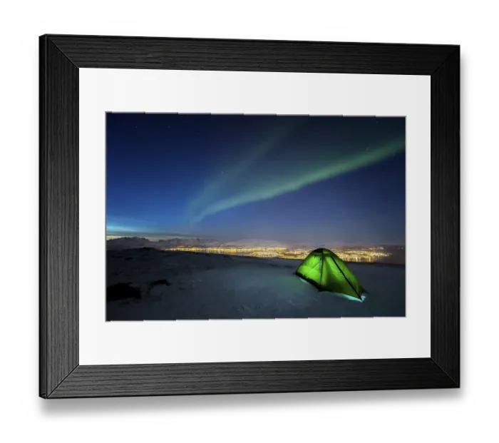 Framed Print : Green illuminated tent in the snow and aurora borealis above Fjellheisen