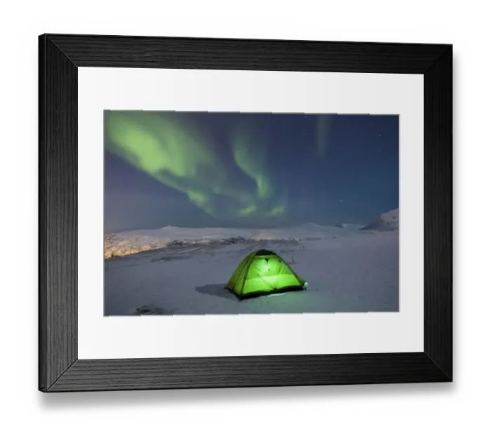 Framed Print : Green illuminated tent in the snow and aurora borealis above Fjellheisen