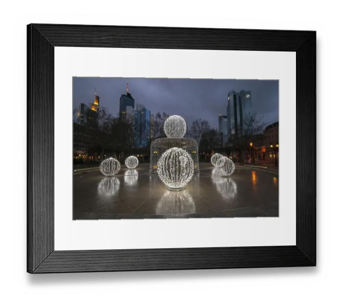 Framed Print : Illuminated Lucae Fountain on Opernplatz square in front of high-rise skyline