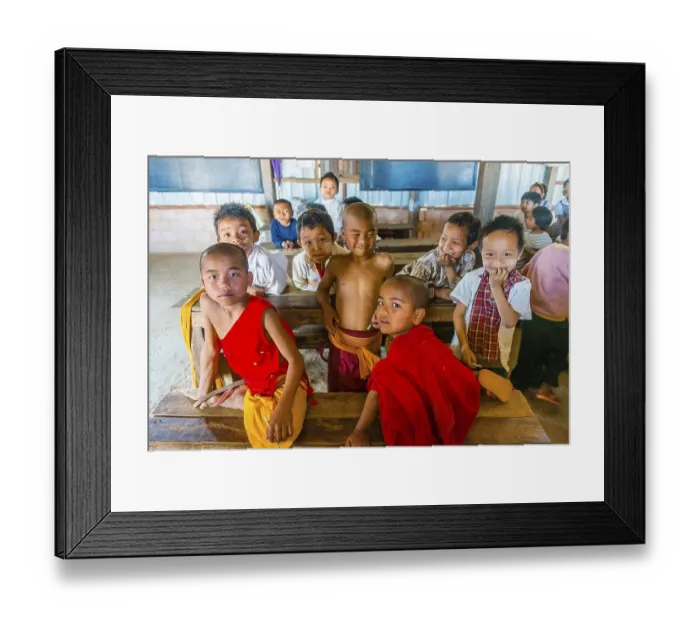 Framed Print : School children sitting at their desks