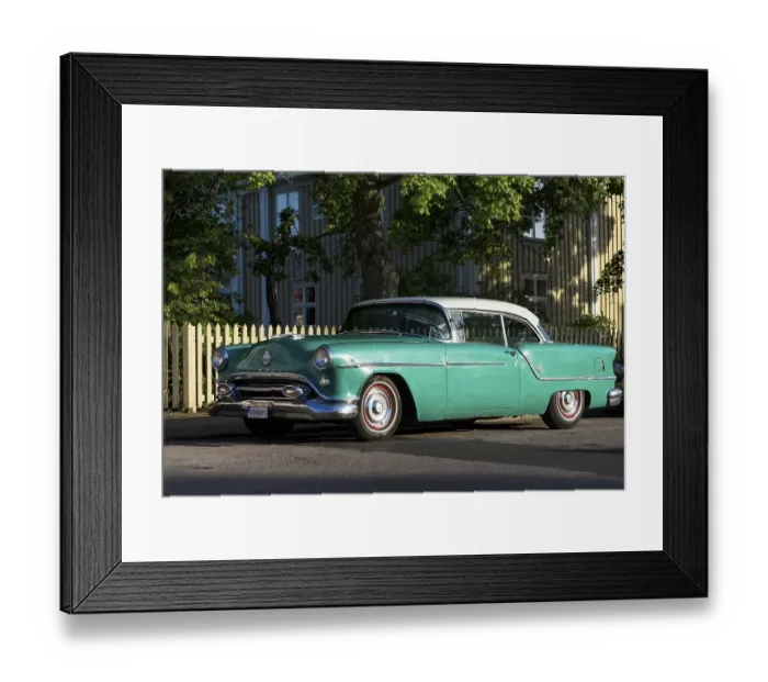 Framed Print : Oldsmobile 88 built in 1954, in front of Swedish wooden house