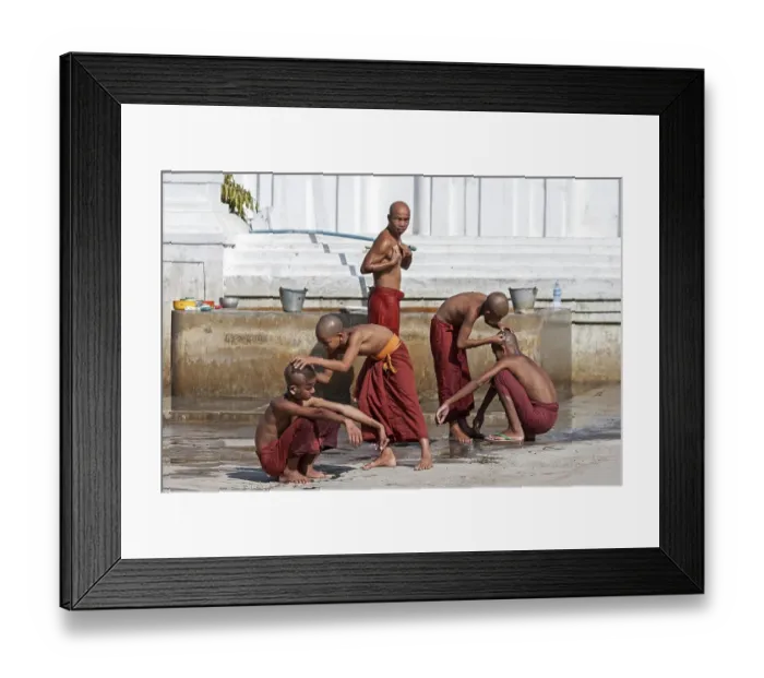 Framed Print : Novice monks during their morning bath with a shaving of the head in the Shwe Yaunghwe Kyaung Monastery Framed Print : Novice monks during their morning bath with a shaving of the head in the Shwe Yaunghwe Kyaung Monastery