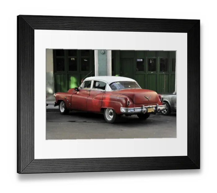 Framed Print : A red vintage car parked on a street corner in Cuba