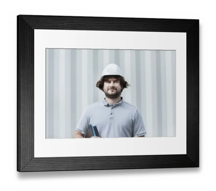 Framed Print : Technician with beard middle aged and working outside with polo shirt and helmet