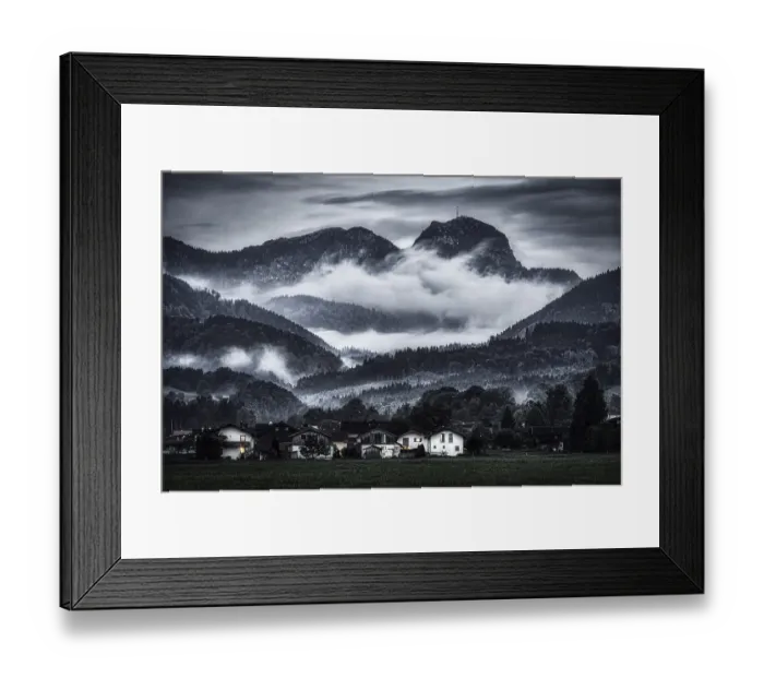 Framed Print : A dramatic landscape with mist-covered mountains