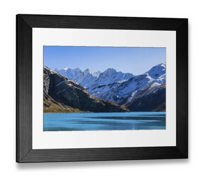 Framed Print : Moiry reservoir, snow-covered mountain peaks behind