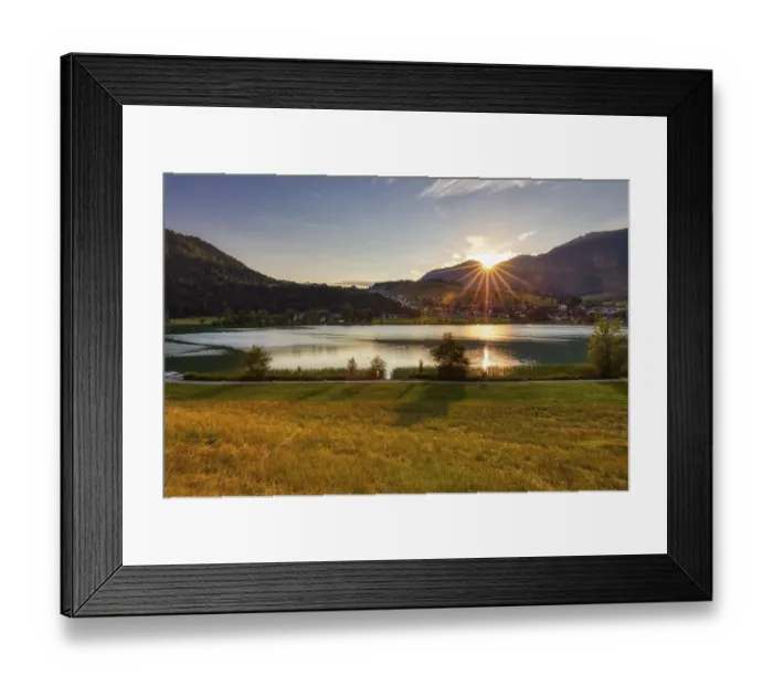 Framed Print : Sunset over a lake with mountains and meadows Framed Print : Sunset over a lake with mountains and meadows