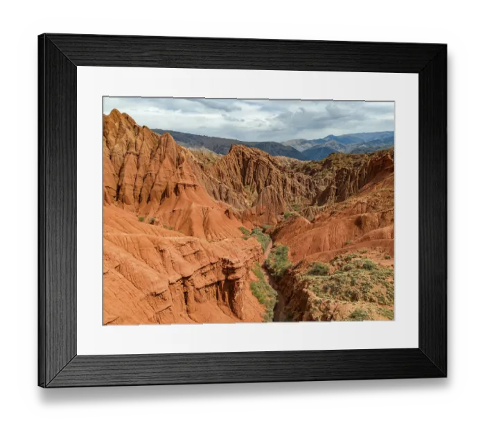 Framed Print : Eroded mountain landscape, canyon with red and orange rock formations