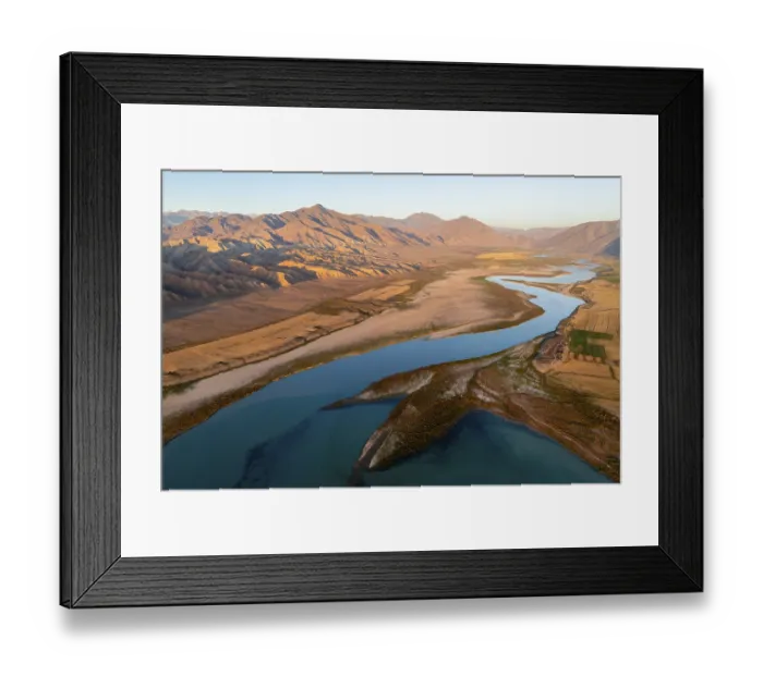 Framed Print : Naryn River between mountains and fields