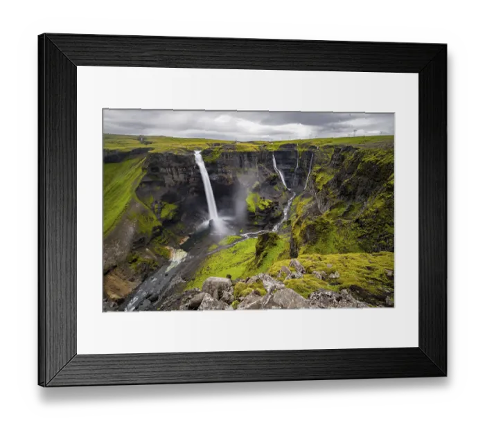 Framed Print : River and waterfalls at a canyon with green moss