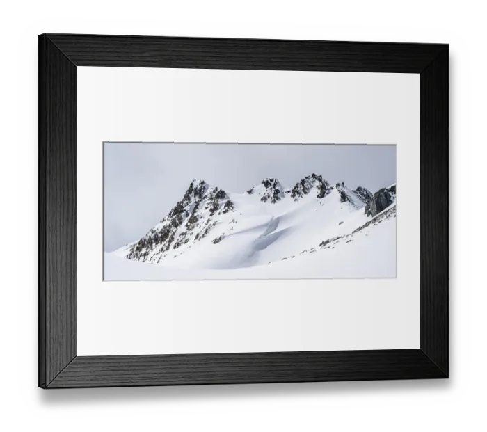 Framed Print : Minimalist winter landscape, white snow and dark mountains on the Scalettahorn
