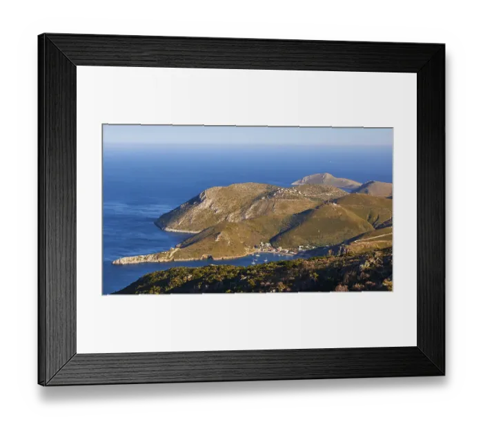 Framed Print : A coastal village at sunset with a view of the sea and mountains Framed Print : A coastal village at sunset with a view of the sea and mountains