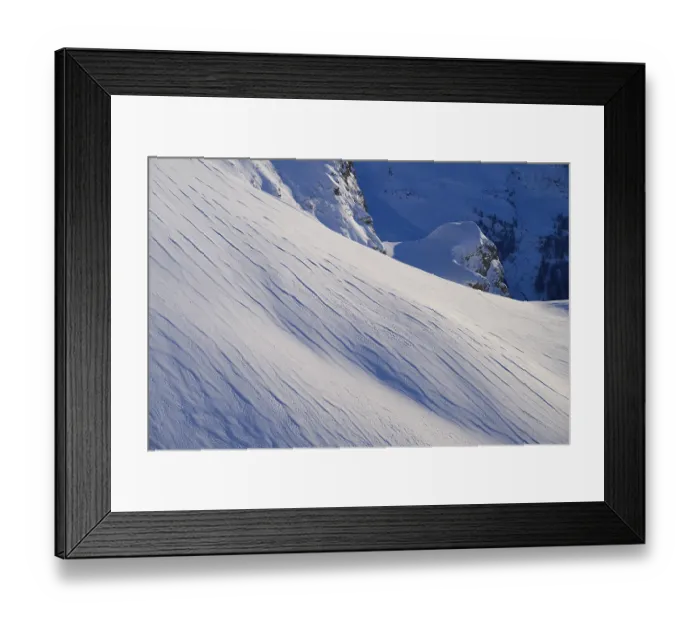 Framed Print : Snow-covered slopes with fine lines under a blue sky Framed Print : Snow-covered slopes with fine lines under a blue sky