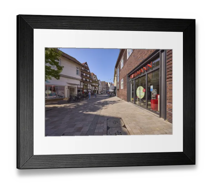 Framed Print : Pedestrian zone Lange Strasse with a branch of the drugstore Rossmann Framed Print : Pedestrian zone Lange Strasse with a branch of the drugstore Rossmann