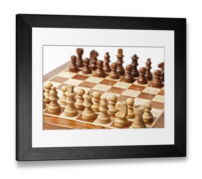 Framed Print : Wooden chess pieces on chessboard