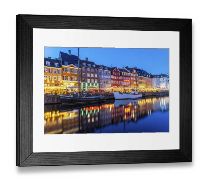 Framed Print : Colourful houses, restaurants and historic ships on the Nyhavn canal and harbour at dusk