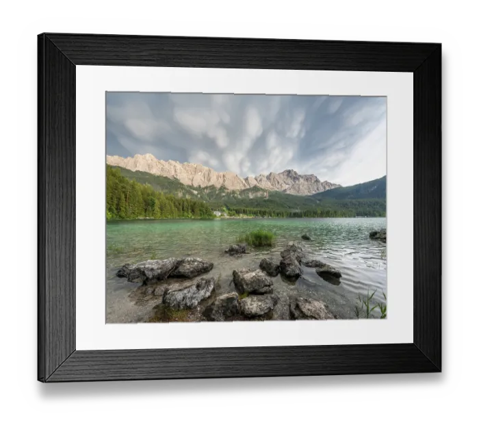 Framed Print : Rocks on the shore, Lake Eibsee lake in front of Zugspitze massif with Zugspitze Framed Print : Rocks on the shore, Lake Eibsee lake in front of Zugspitze massif with Zugspitze