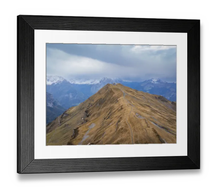 Framed Print : Panoramic view of a barren mountain landscape in autumn with clouds and a path on the summit