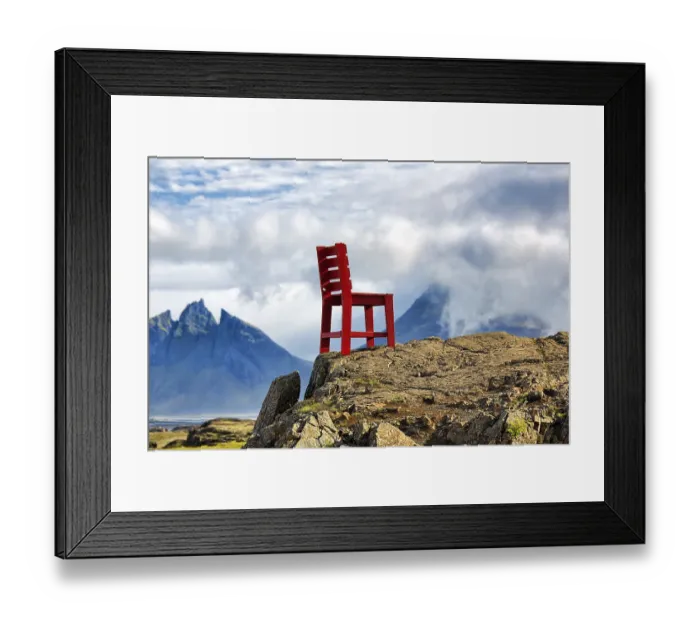Framed Print : Red wooden chair on a rock, view of Mount Brunnhorn