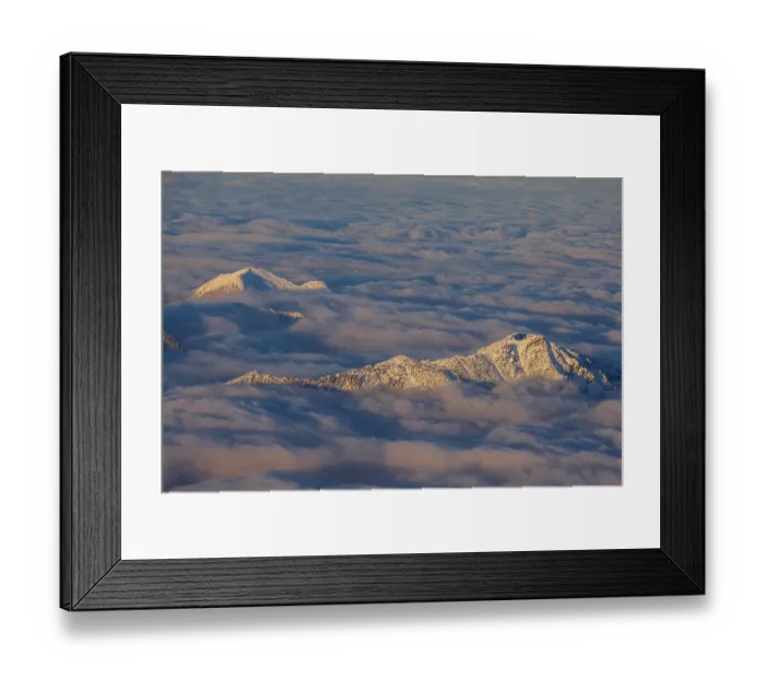 Framed Print : Mountain peak above high fog, evening light