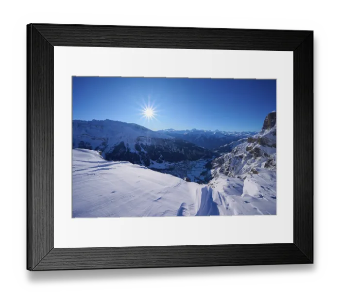 Framed Print : Snowy mountain landscape under a clear blue sky with bright sunshine