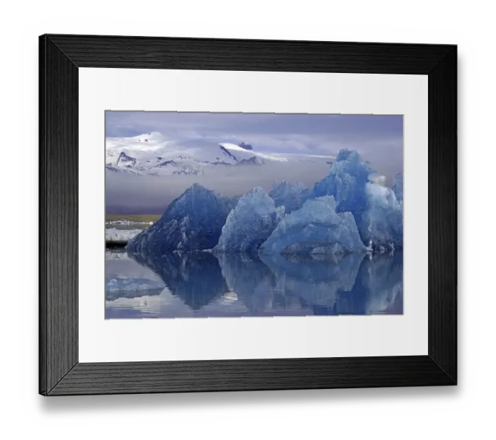 Framed Print : Blue iceberg reflected in calm water