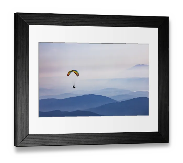 Framed Print : Paragliders high above the mountains with a view of the Klagenfurt basin and the Karawanken