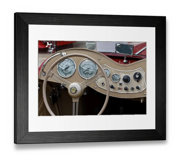Framed Print : Steering wheel and curved dashboard of a MG TD MK II convertible Framed Print : Steering wheel and curved dashboard of a MG TD MK II convertible