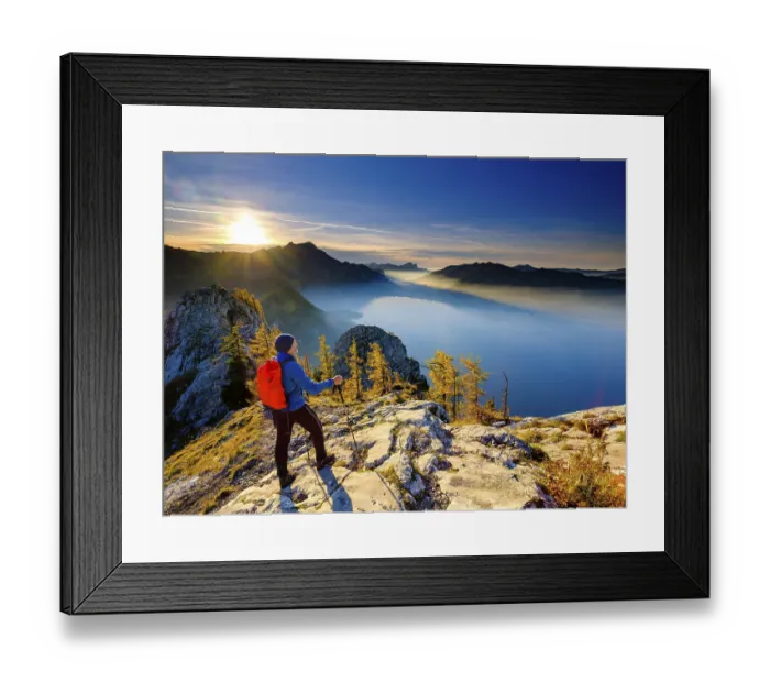 Framed Print : Mountaineers on the large Schoberstein in the evening light with a view of Attersee and Mondsee