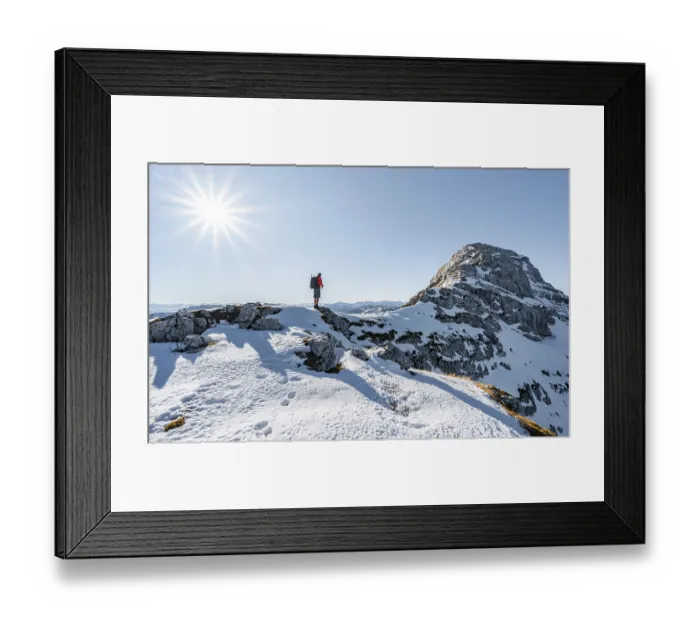 Framed Print : Climbers on the rocky summit ridge with first snow in autumn