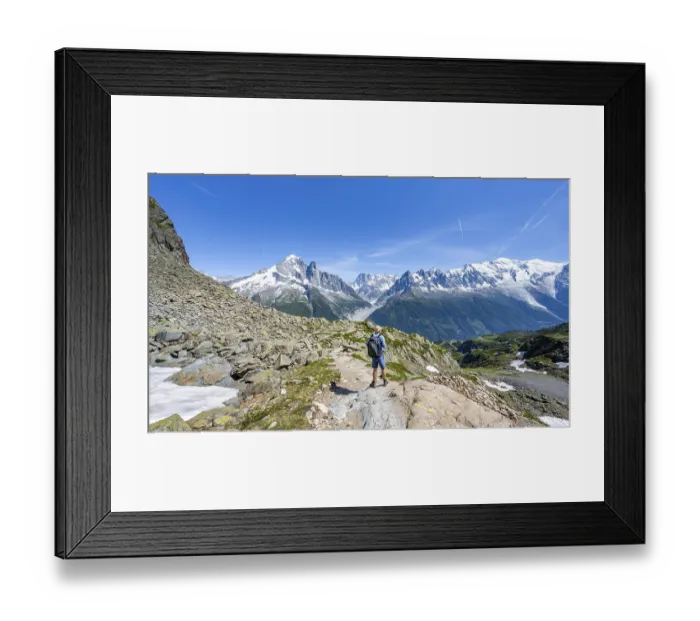 Framed Print : Mountaineers on a hiking trail in front of a mountain landscape Framed Print : Mountaineers on a hiking trail in front of a mountain landscape