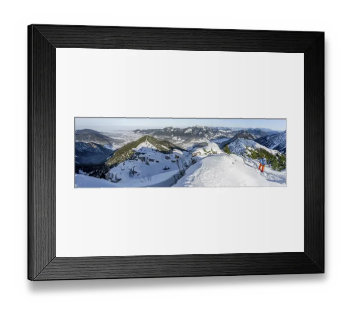 Framed Print : Hiker in winter climbing the Aiplspitz