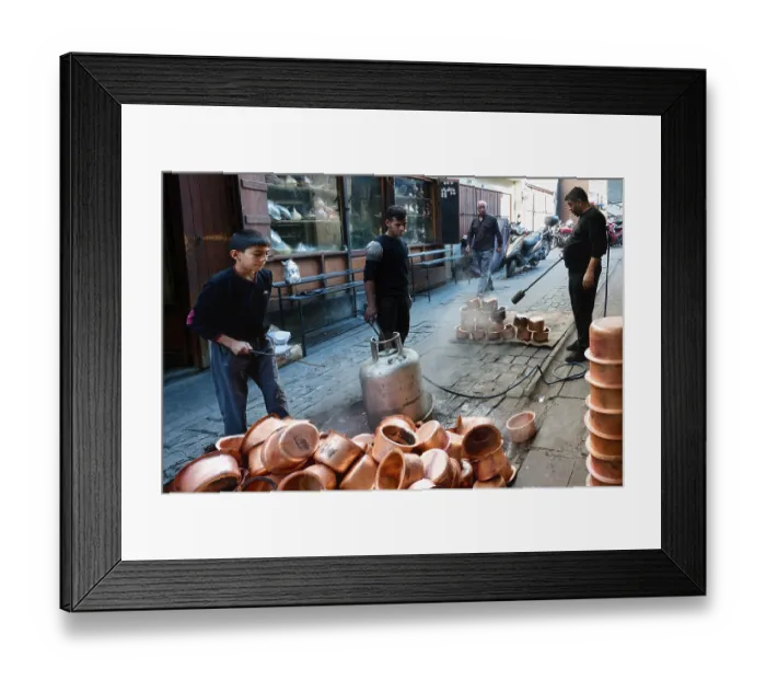 Framed Print : Artisan bleaching small copper containers Framed Print : Artisan bleaching small copper containers