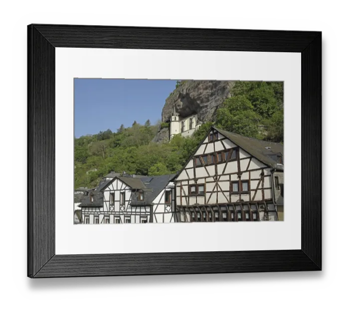 Framed Print : Rock church built in 1484, landmark and half-timbered houses